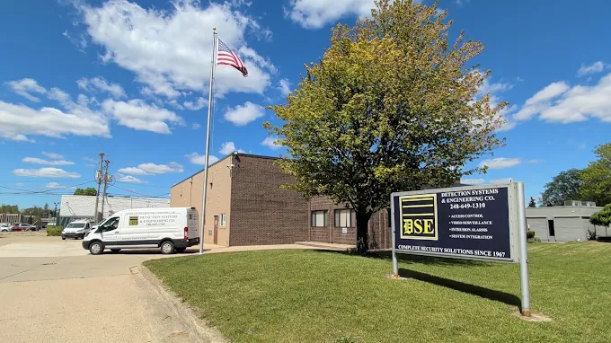 Brick office building and blue DSE roadside sign at 1450 Temple City Drive.